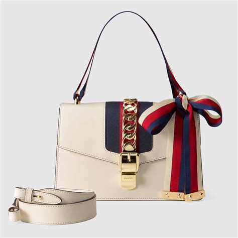 white gucci handbag.